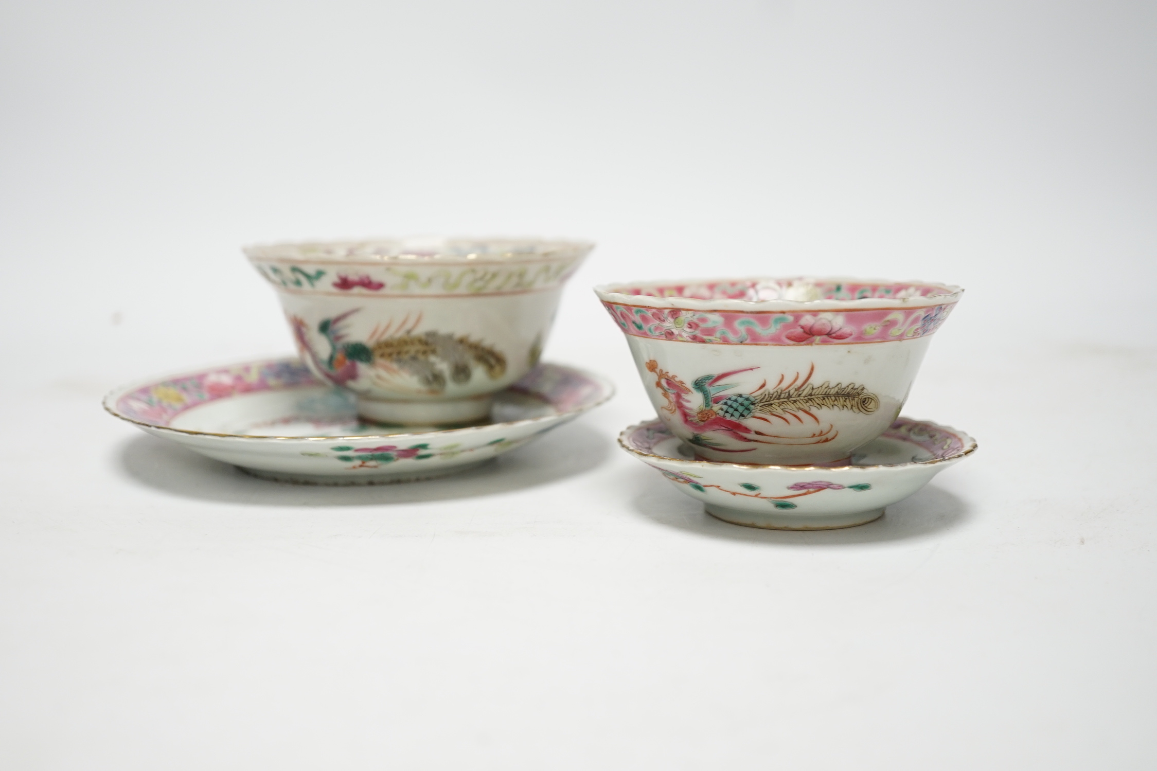 Two Chinese Straits Nonya ware famille rose tea bowls, larger 11cm diameter, and two saucer dishes, Guangxu period